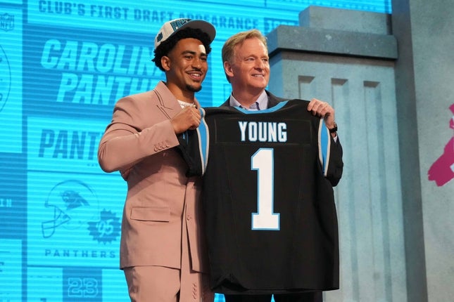 Apr 27, 2023; Kansas City, MO, USA; Alabama Crimson Tide quarterback Bryce Young (left) after being selected by the Carolina Panthers with the first round of the 2023 NFL Draft at Union Station Photo with NFL Commissioner Roger Goodell after the draft.